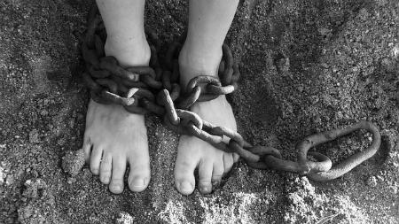 white child in chains