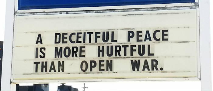Marathon sign: "A deceitful peace is more hurtful than open war."