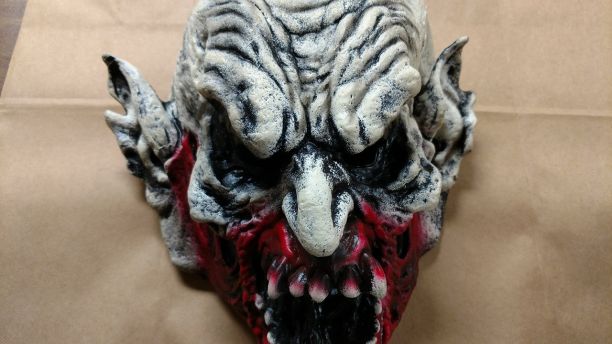 Scary clown mask with blood from the attacker on it. // Image: Holly Hills Police Department