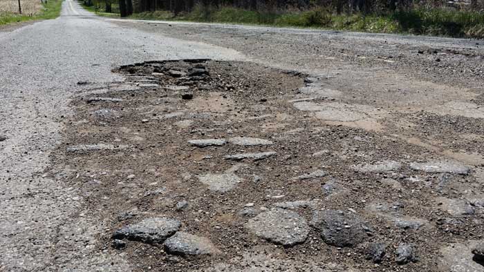 Crumbling roads and potholes