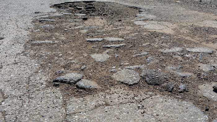 Crumbling roads and potholes