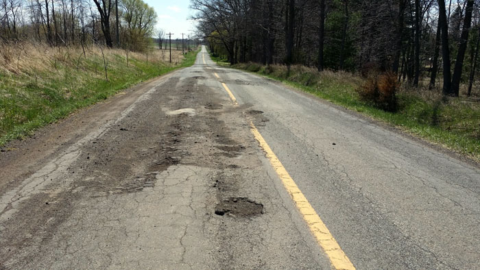 Crumbling roads and potholes